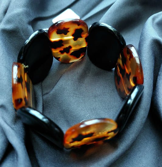 TORTOISE SHELL AND BLACK OVAL ELASTICATED BRACELET